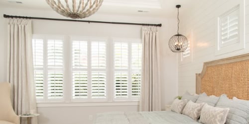 Plantation shutters in a bedroom